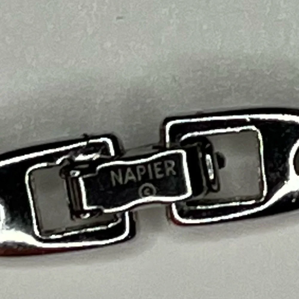 Napier 3 strand silver graduating length chain necklace.